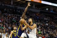 Draymond Green of the Golden State Warriors and Rudy Gobert of the Minnesota Timberwolves